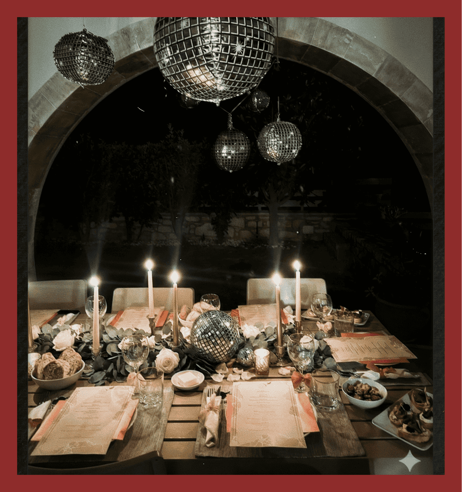 Disco balls and candlelit dinner table decor for stylish events, perfect for parties and upscale gatherings.