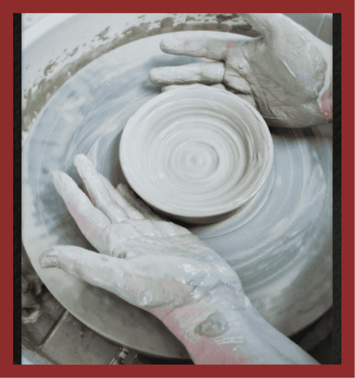Pottery wheel in action with clay shaping.
