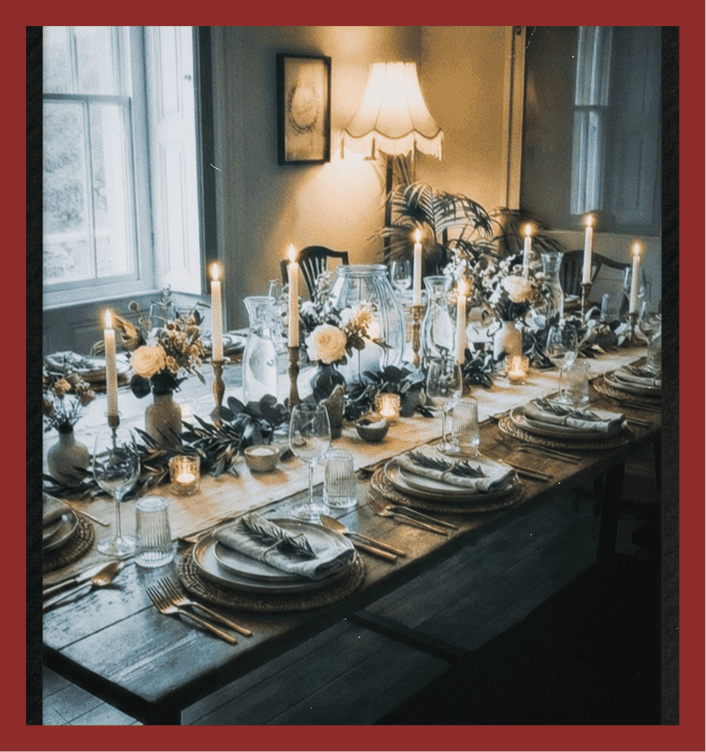 Beautifully decorated dinner table with candles, flowers, and elegant tableware. Perfect for upscale events and intimate gatherings.
