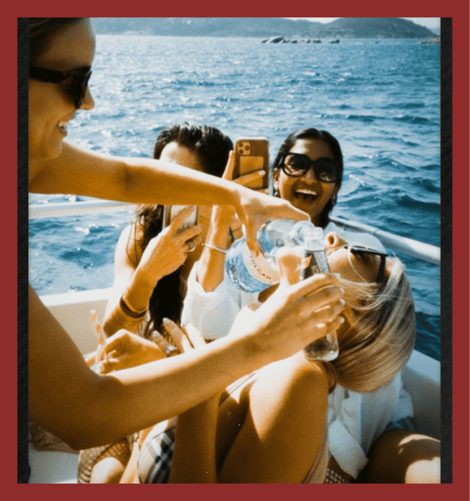 Image of friends having a fun boat party on the water, sharing drinks, taking photos, and enjoying the sunny day on a yacht. Perfect for leisure and travel content.